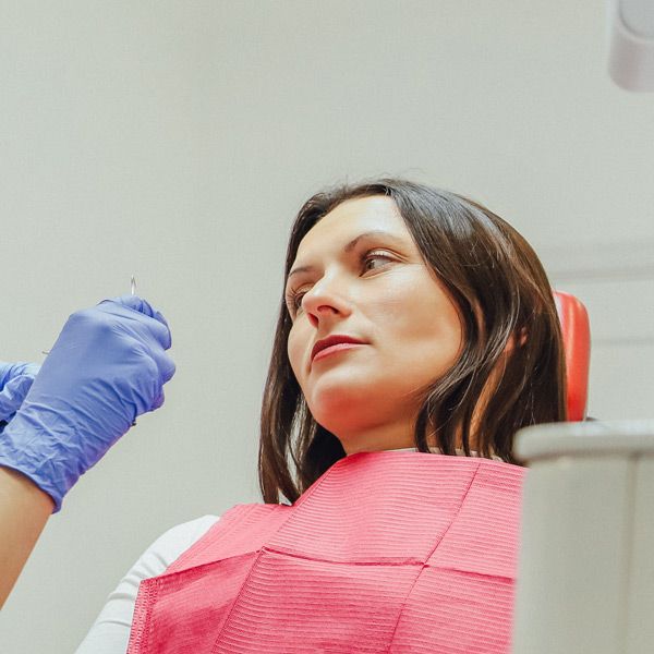 A woman sitting in a dental chair